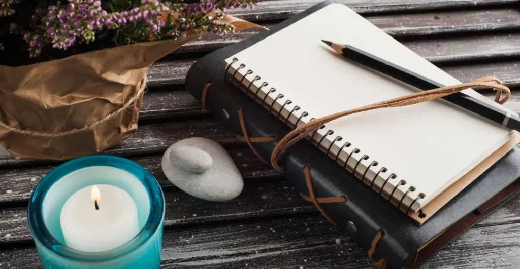 Journal and candle on desk, Life by Design