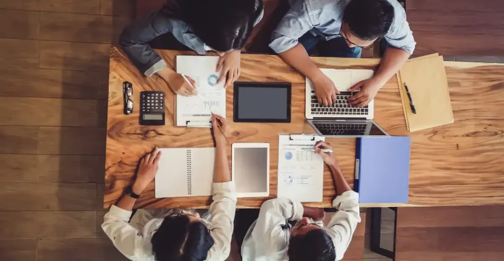 a team examining systems design to reduce friction