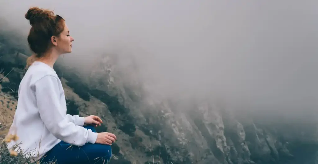 woman practicing liberated living during meditation